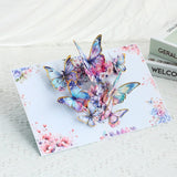 Card with colorful butterfly design on a white surface