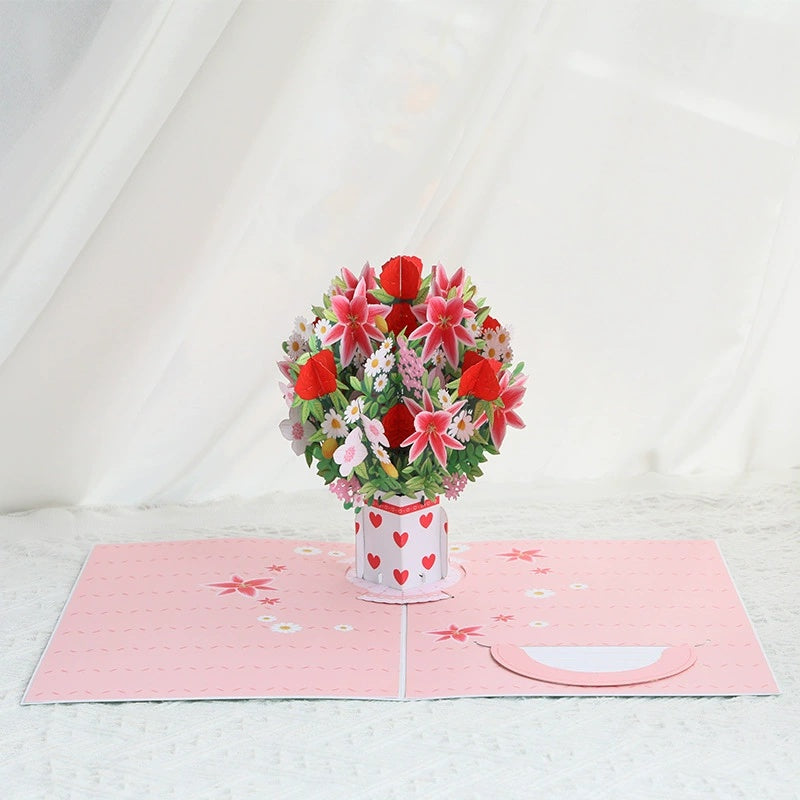 Pop-up card with a bouquet of flowers and a vase on a white background