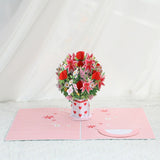 Pop-up card with a bouquet of flowers and a vase on a white background