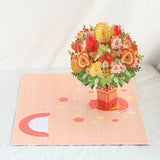 Pop-up card with a bouquet of flowers and a vase on a white background