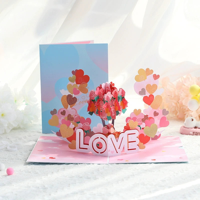 Pop-up card with heart designs and 'LOVE' text on a white background