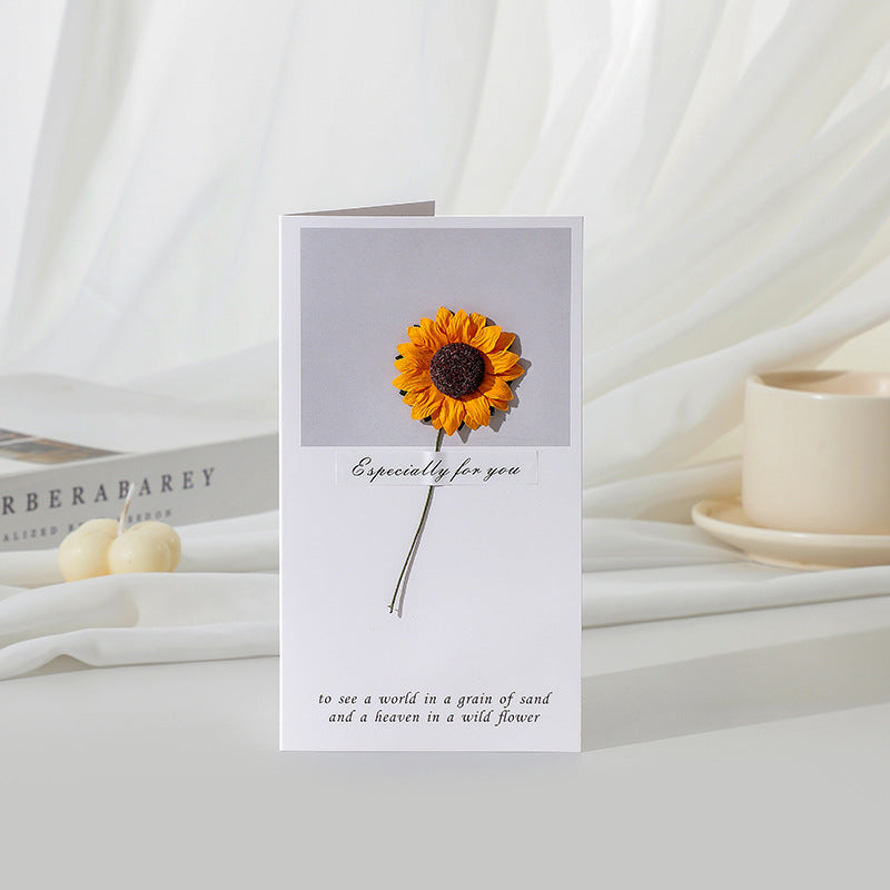 Greeting card with a sunflower design on a white surface