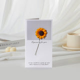Greeting card with a sunflower design on a white surface