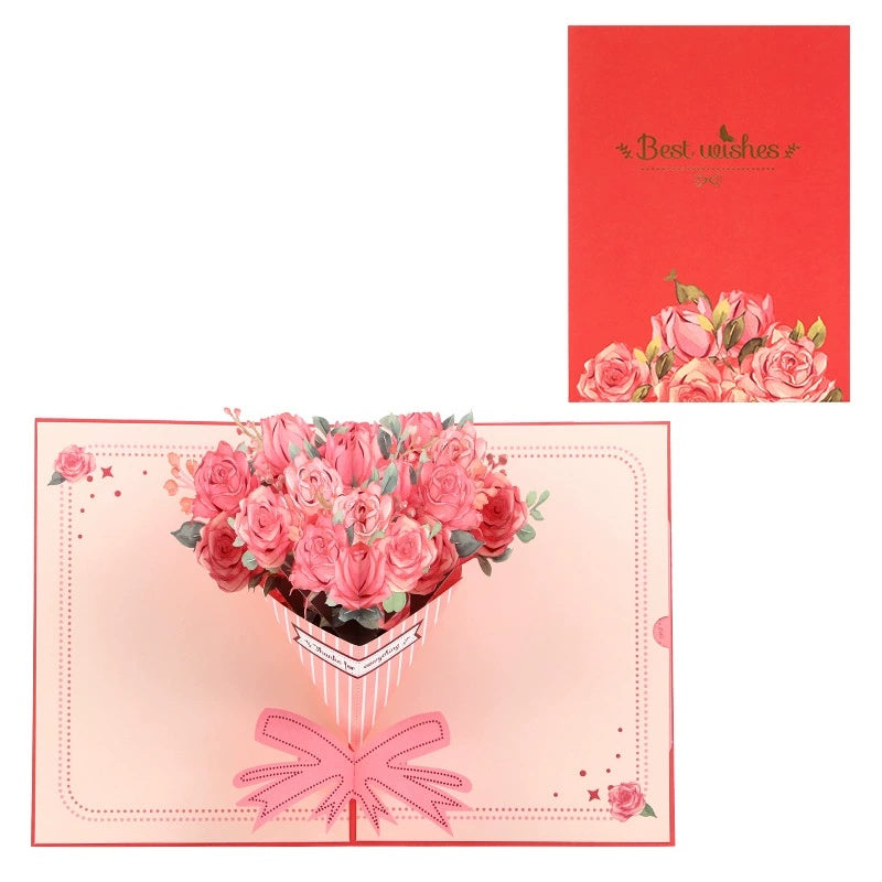 A 3D pop-up greeting card with a bouquet of pink roses and a bow, and a red envelope with a floral design.