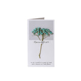 Greeting card with dried flowers and text on a white background