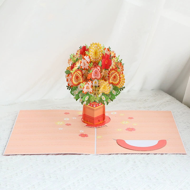 Pop-up card with a bouquet of flowers on a white surface