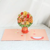 Pop-up card with a bouquet of flowers on a white surface