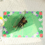 3D paper craft of a deer on a green floral background