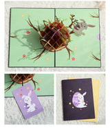 Collage of Easter-themed greeting cards with rabbits and eggs on a textured surface.