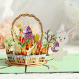Easter-themed pop-up card with a basket, eggs, flowers, and a rabbit on a white background.