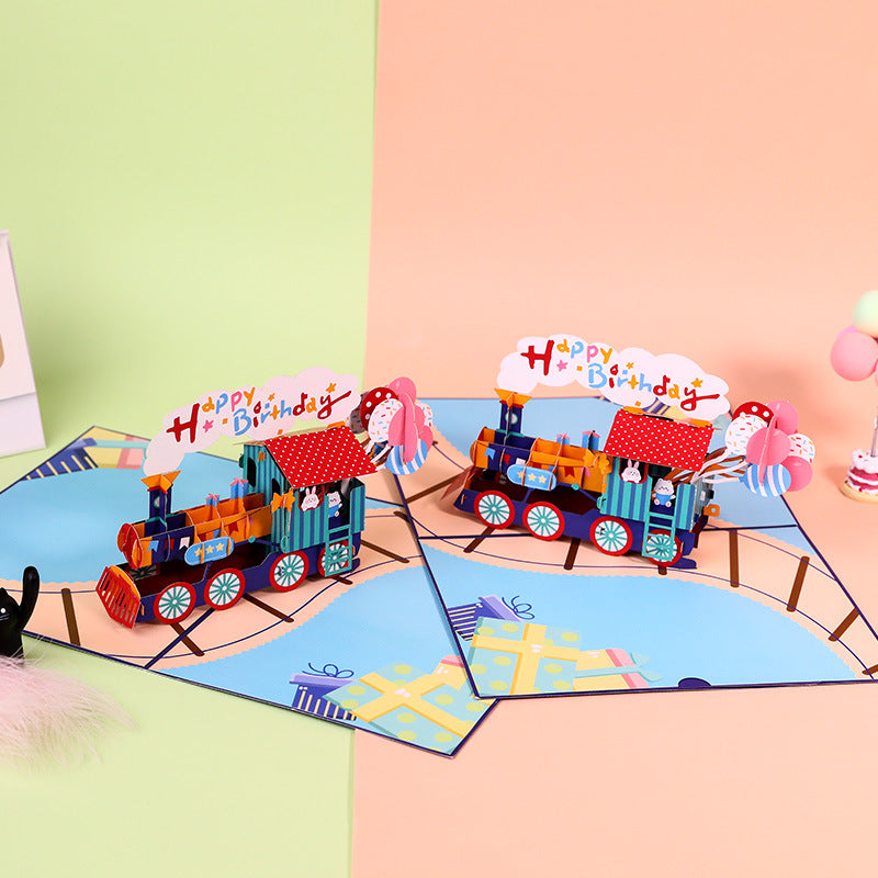 Colorful birthday card with a train design on a colorful background